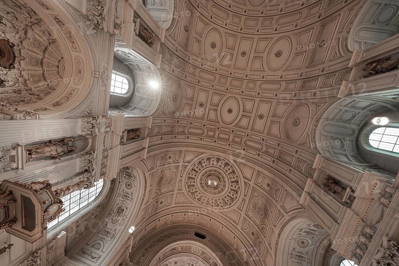 Magnificent domed ceiling of a historic church with baroque decorations, Munich, Germany