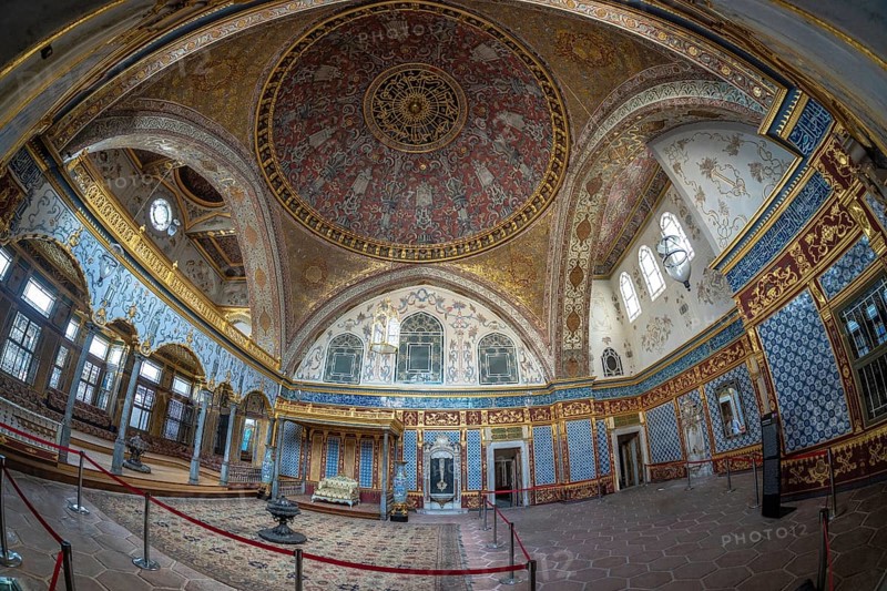 Wide angle view of the richly decorated interior of topkapi palace, showcasing intricate ottoman architecture and design