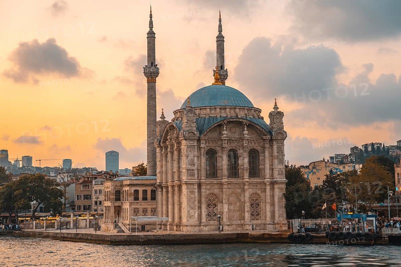 Ortakoy mosque, located on the shores of bosphorus strait, creates a picturesque scene during sunset in istanbul, turkey