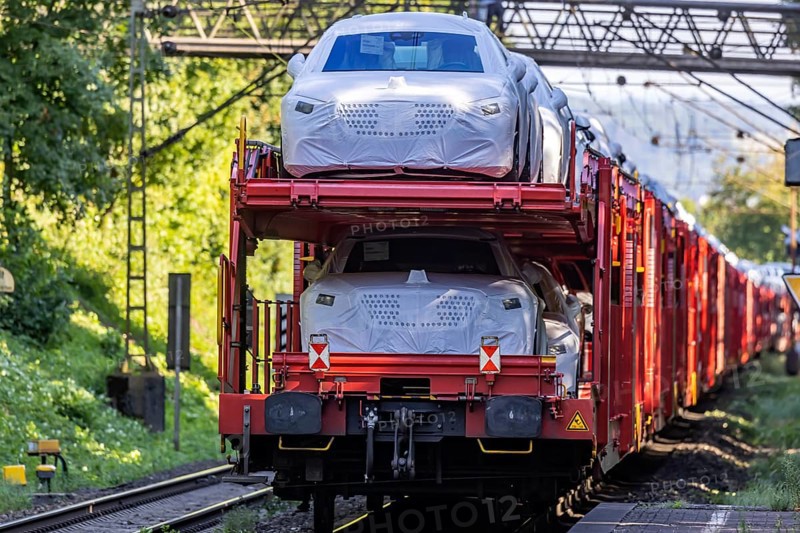 Car train with new cars on the railway line near Stuttgart. The so-called Schusterbahn is a bypass of Stuttgart main station and is mainly used by goods trains. Stuttgart, Baden-Württemberg, Germany