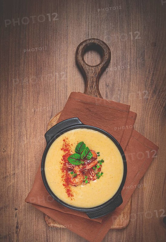 Pumpkin cream soup with shrimp, herbs and spices, homemade, no people