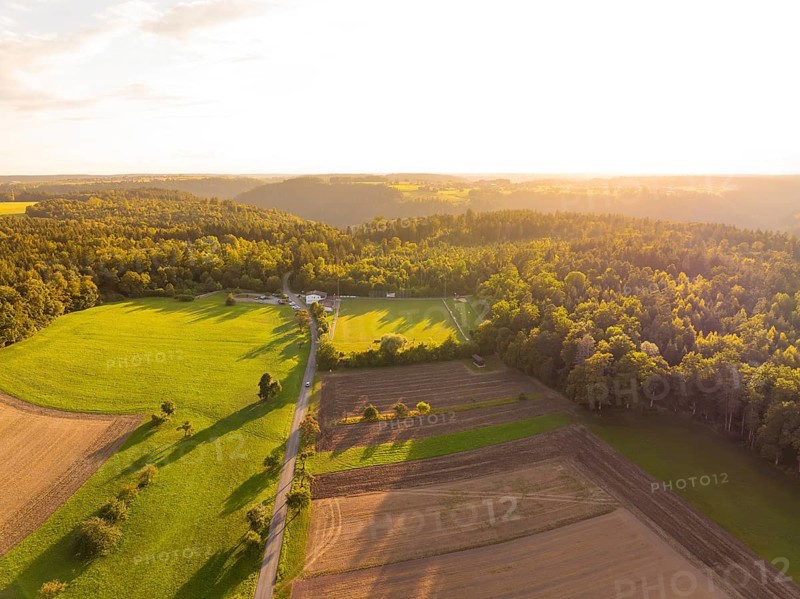 Wide landscape with shadow play over fields and forests at sunset, VFL Stammheim, Calw, Black Forest, Germany