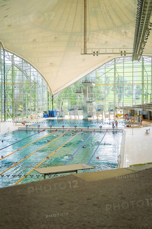 Spacious indoor swimming pool with large window fronts that let in plenty of light, Olympiapark, Munich, Germany