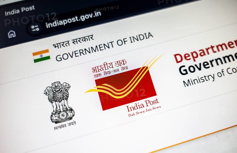 New Delhi, India – August 23, 2025: In this photo illustration, the India Post logo is seen on a digital display. The Indian Department of Posts has announced a temporary suspension of most postal services to the United States from Aug 25