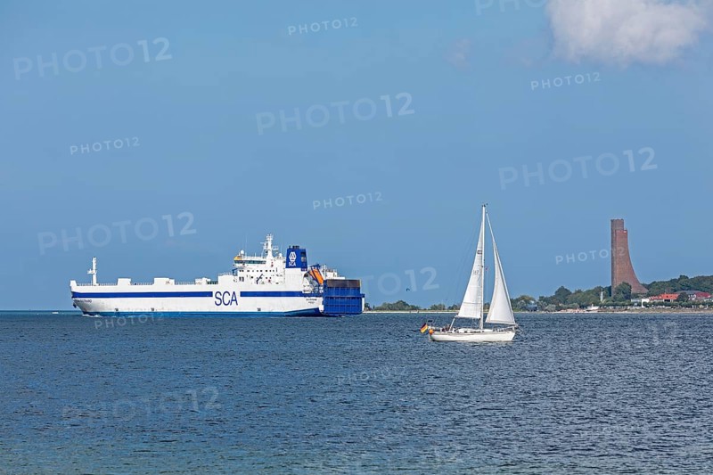 Sailing boat, cargo ship, naval memorial, Laboe, Kiel Fjord, Schleswig-Holstein, Germany