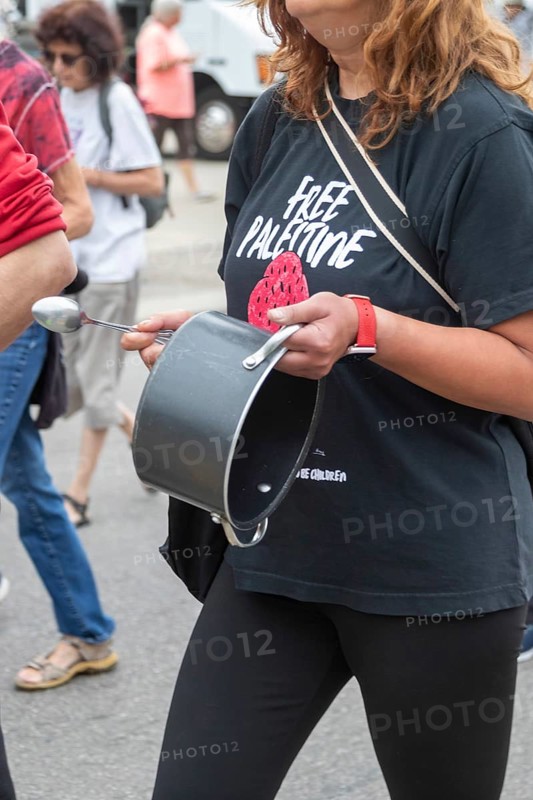 Detroit, Michigan USA - 23 August 2025 - Protesters rally at Eastern Market, banging empty pots to protest starvation in Gaza