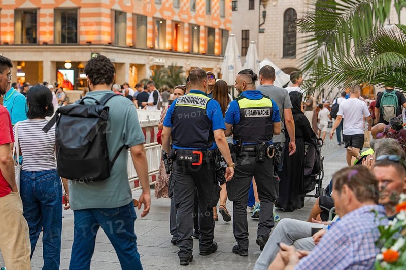 Urban scene with security forces and numerous passers-by, Munich, Germany