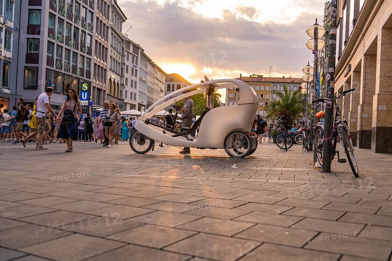 Bicycle taxi in Munich city centre at sunset, Munich, Germany