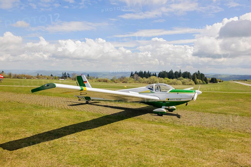 Motor glider of type Scheibe SF.25C Falke is parked at Wasserkuppe airfield, Wasserkuppe airfield, Rhön, Gersfeld, district of Fulda, Hesse, Germany