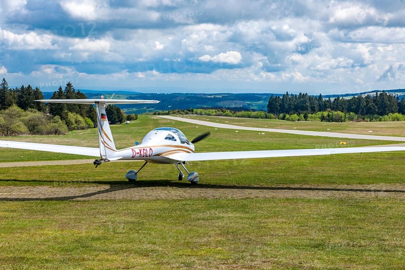 Motorised glider taxiing to the runway at Wasserkuppe airfield, Rhön, Gersfeld, Fulda district, Hesse, Germany