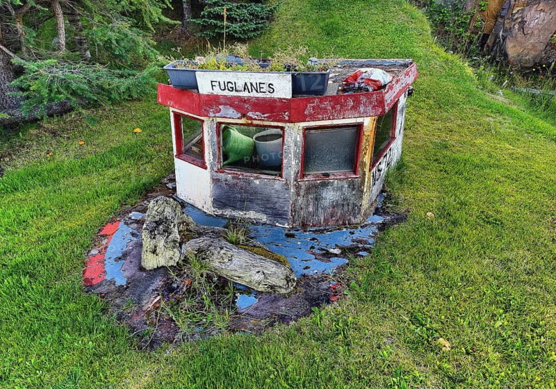 Front garden with old boat top as decoration and mown lawn, Vopnafjördur, East Iceland, Iceland