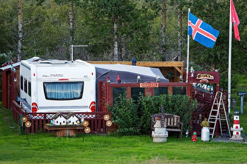 Icelandic permanent camper with full decoration and Icelandic flag at the campsite in Uthlid in Biskupstungur, Iceland