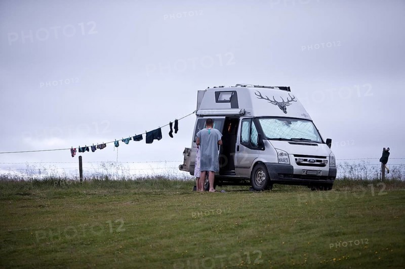 Campervan with clothesline at the campsite in Reykjadiskur at Skagafjördur, Iceland