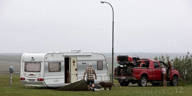 Pick-up with quad bike and caravan at the campsite in Laugarbakki, Northwest Iceland, Iceland