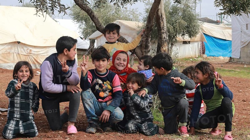 A group of Syrian refugee children gathered inside a camp. Aleppo, Syria July 3, 2015, Aleppo, Syria