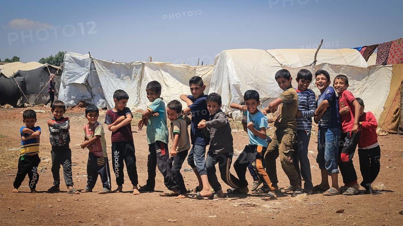 A group of Syrian refugee children gathered inside a camp. Aleppo, Syria February 1, 2015, Aleppo, Syria