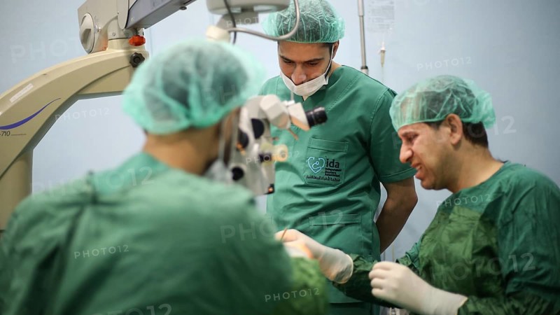 Several doctors performing a complex surgical operation inside an operating room for a displaced patient. Aleppo, Syria. October 18, 2022, Aleppo, Syria