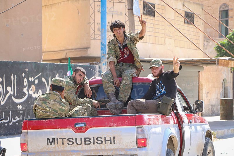 Fighters from the Free Syrian Army celebrate victory after capturing villages that were under the control of ISIS. Aleppo, Syria September 01, 2016, Aleppo, Syria