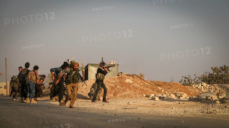 Syrian opposition fighters firing small arms and heavy weapons during the expulsion of ISIS militias from northern Syria. Aleppo, Syria October 10, 2016, Aleppo, Syria