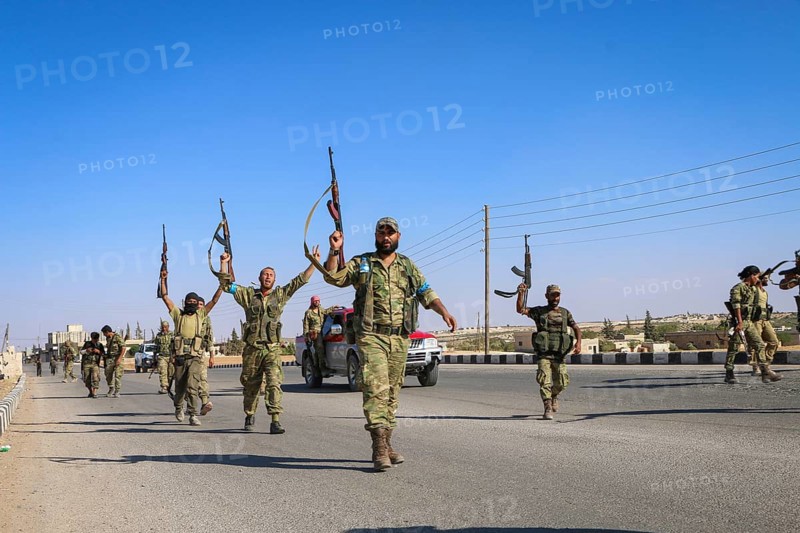 Fighters from the Free Syrian Army celebrate victory after capturing villages that were under the control of ISIS. Aleppo, Syria September 04, 2016, Aleppo, Syria