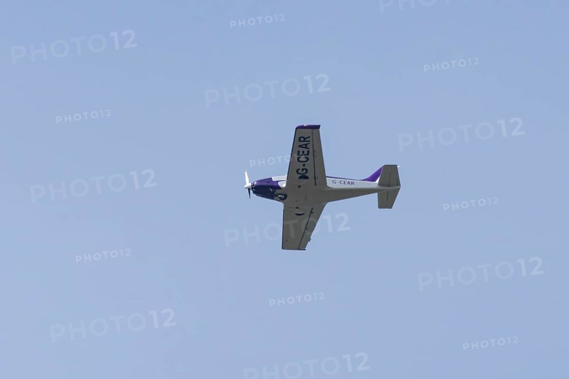 Alpi Pioneer 300 light aircraft flying in a blue sky, England, United Kingdom