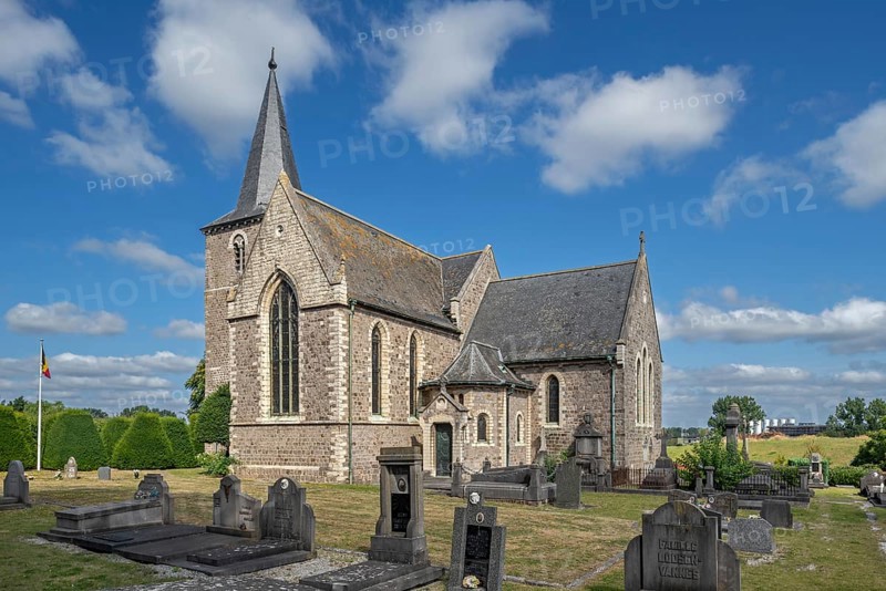 The old Sint-Pieterskerk, St. Peter's Church, now necropolis with graves of Belgian WWI soldiers buried inside at Grimde, Tienen, Tirlemont, Belgium