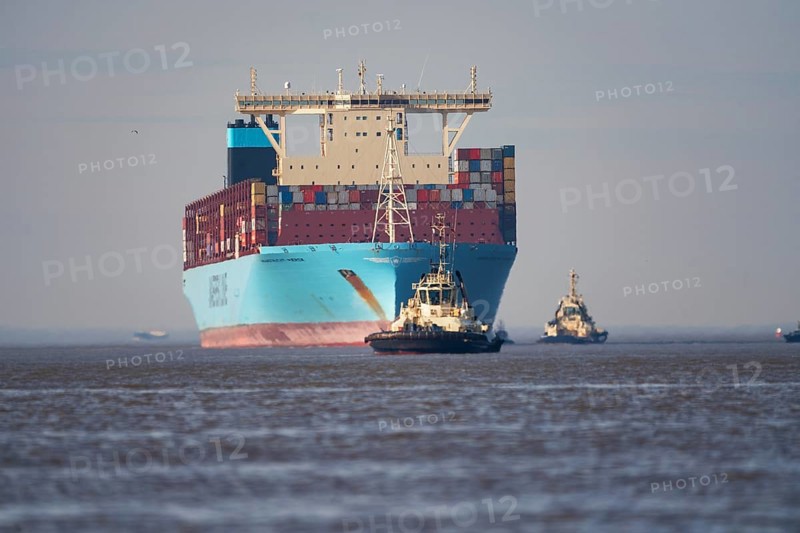 Container ship with pilot vessels near Bremerhaven, Lower Saxony