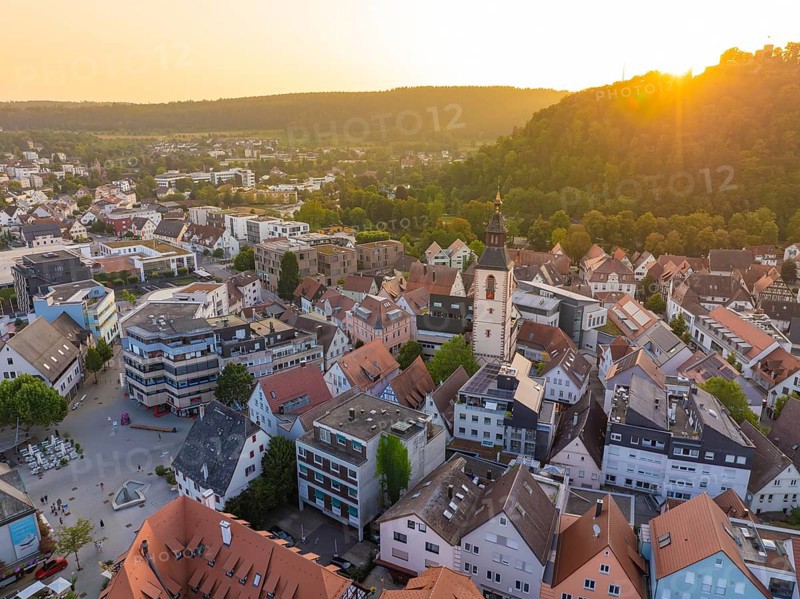 Evening view of an old town with church tower, surrounded by nature and hills, Nagold, district of Calw, Black Forest, Germany