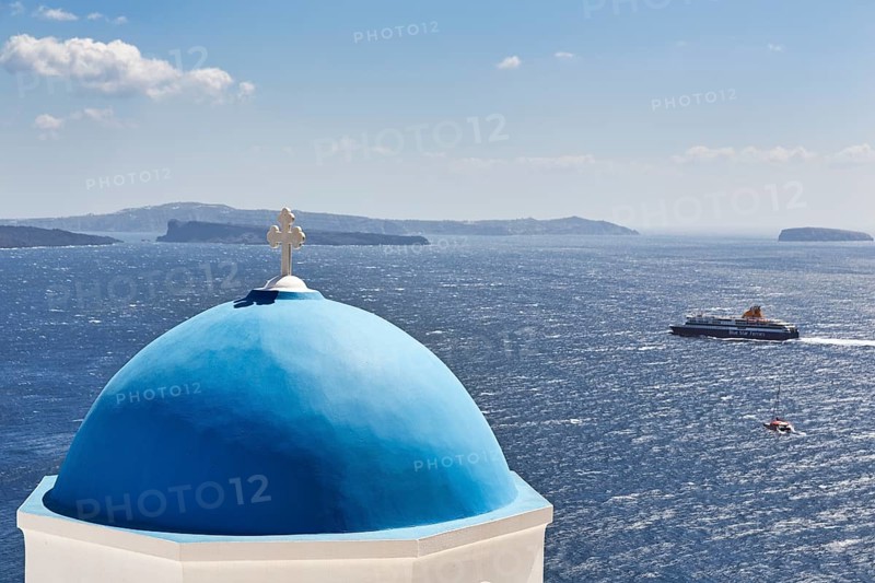 Blue dome of an orthodox church, ferry crossing the sea, Caldera, Oia, Thira, Santorini, Cyclades, Greece