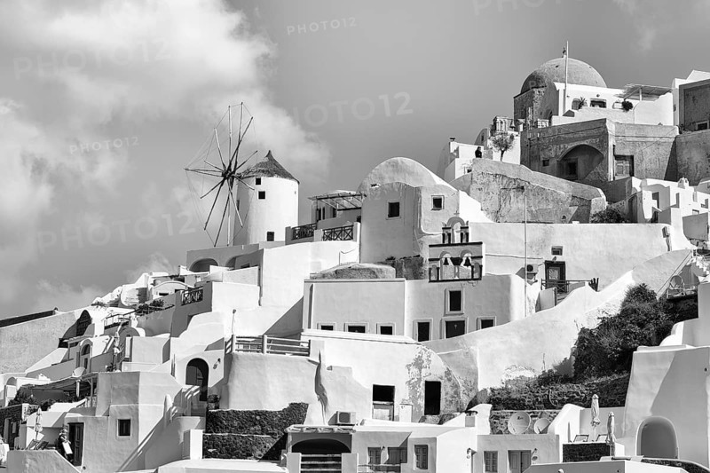 Typical cube-shaped holiday homes and windmill on a steep slope, Cumulus, monochrome, Oia, Thira, Santorini, Cyclades, Greece