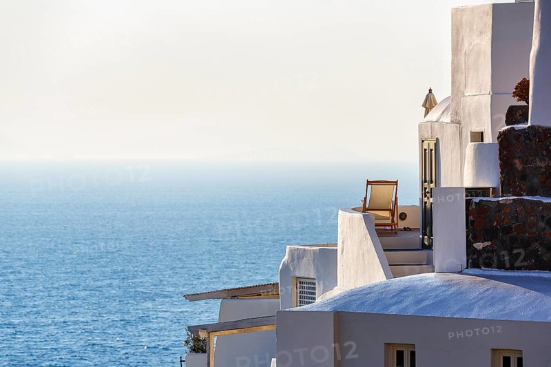 Sun lounger on terrace, holiday home with sea view, evening light, Oia, Thira, Santorini, Cyclades, Greece