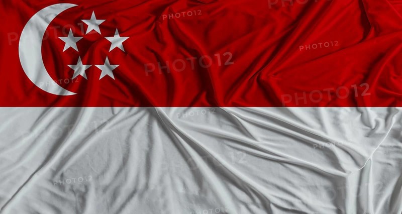 Singaporean flag with fabric texture background. National flag of Singapore with cloth texture