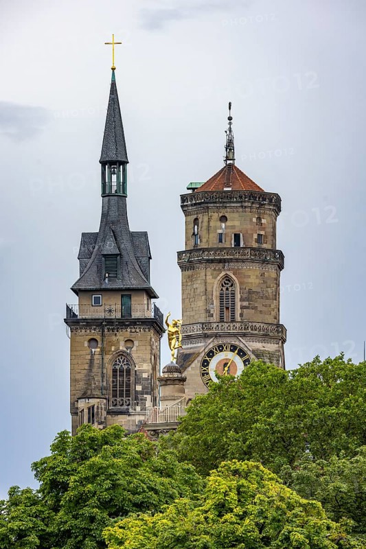 City view of Stuttgart with the two towers of the collegiate church. In between, the Mercury Column with the gilded figure of Mercury. Stuttgart, Baden-Württemberg, Germany