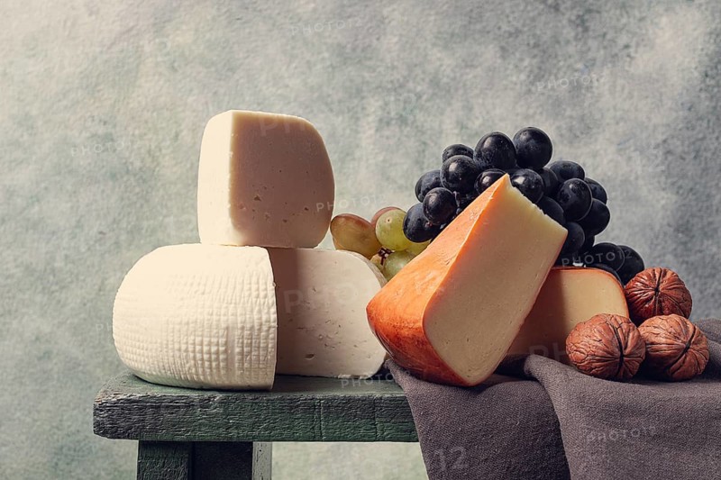 Georgian cheese, Imeretian and smoked suluguni, grapes, nuts, on a cutting board, Georgian cuisine, no people