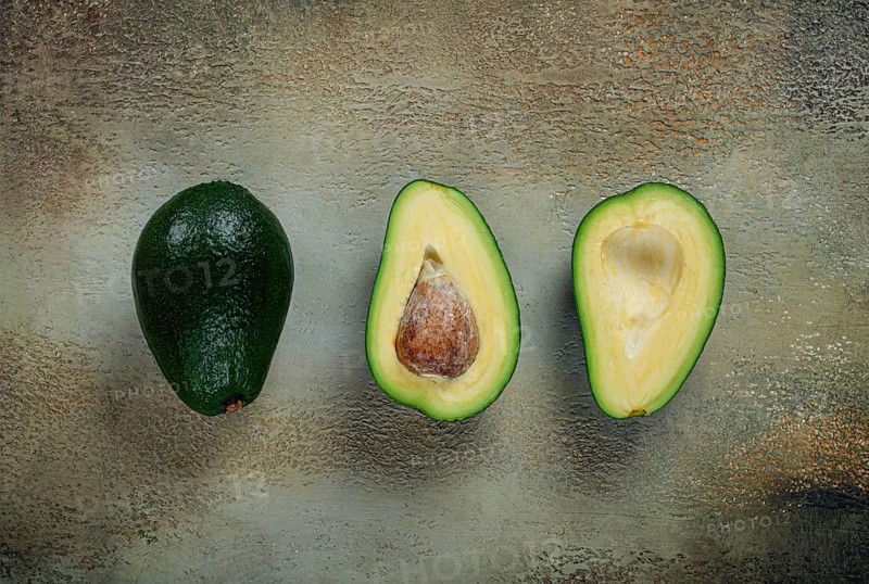 Fresh sliced avocado on the table, top view, food background, concept, menu, food styling