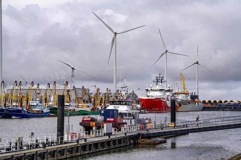 Working vessels in the seaport of Eemshaven, dredger Vitus Bering, aft, cable laying and offshore supply and working vessel Seaway Aimery, fishing boats, trawlers, Netherlands