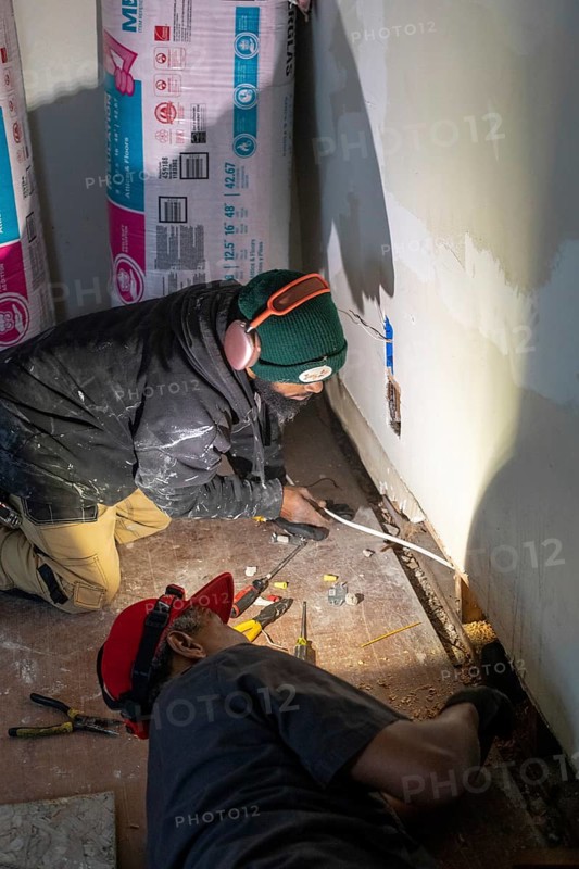 Detroit, Michigan - Workers remodel a house in the Morningside neighborhood that had been vacant for many years. Detroit lost nearly two-thirds of its residents from 1950 to 2020 but has been growing modestly in recent years