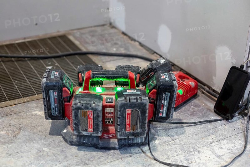 Detroit, Michigan - Batteries for power tools recharge as workers remodel a house in the Morningside neighborhood. The house had been vacant for many years. Detroit lost nearly two-thirds of its residents from 1950 to 2020 but has been growing modestly in recent years