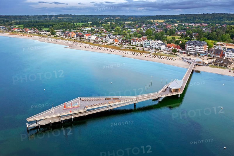 Aerial view over Seebrücke, pier and sandy beach at seaside resort Haffkrug along the Baltic Sea, Scharbeutz, Schleswig-Holstein, Germany