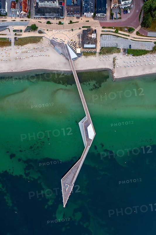 Aerial view over Seebrücke, pier and sandy beach at seaside resort Haffkrug along the Baltic Sea, Scharbeutz, Schleswig-Holstein, Germany