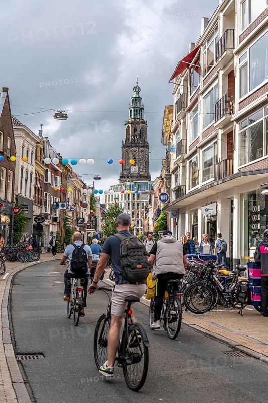Cycling in the city centre of Groningen, old town, Netherlands