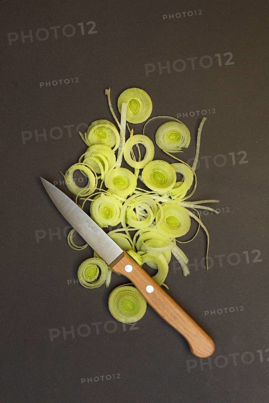 Leeks, leek rings with kitchen knife, sliced leek stalk, leek