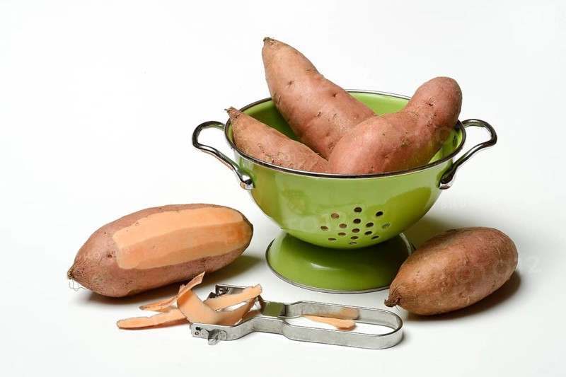 Sweet potato with potato peeler, Ipomoea batatas