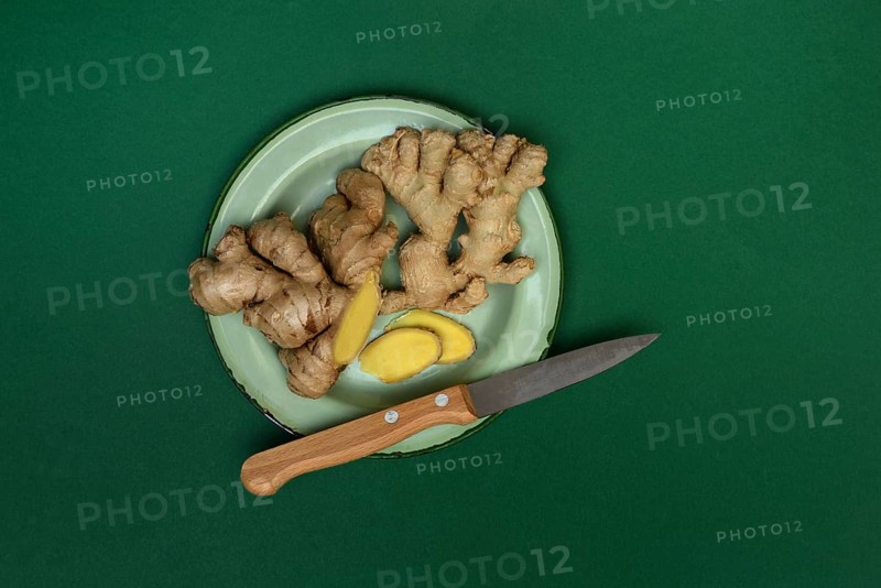 Ginger, ginger tubers with kitchen knife on plate, Zingiber officinale