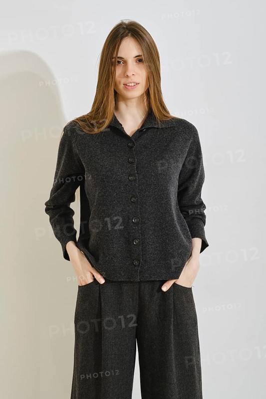 A stylish woman showcases a trendy outfit that prioritizes comfort and practicality