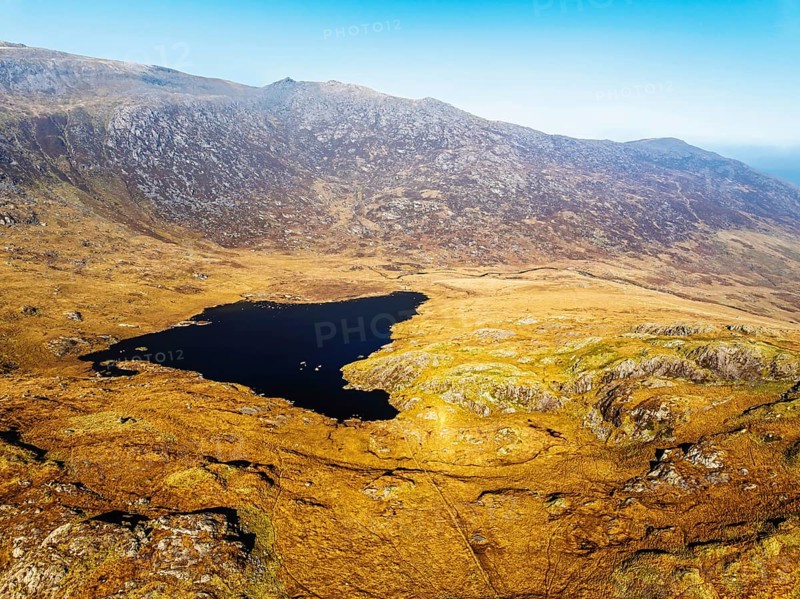 Autumn colours over Llyn Cwmffynnon and Miner's Track, Start Point, road A4086 from a drone, Pen-y-Pass, Snowdonia, Wales, UK