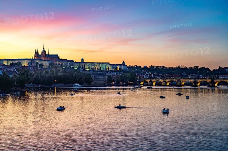 Sunset over the Vltava River, Charles Bridge and Prague Castle in Prague, Czech Republic