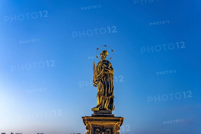 Saint John Nepomuk on Charles Bridge at dusk, Prague, Czech Republic