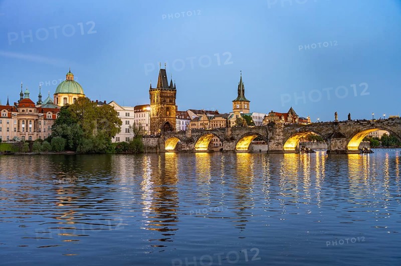 Old Town of Prague with Vltava River, Charles Bridge and Old Town Bridge Tower at dusk, Prague, Czech Republic