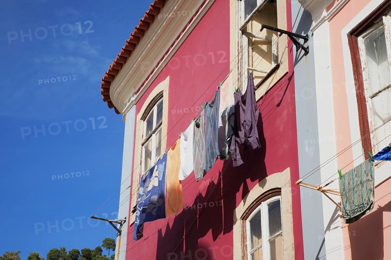 Laundry is dried on a line in front of a house in the spa town of Monchique, Algarve, Portugal